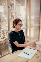 Female carpenter using laptop computer at desk in office