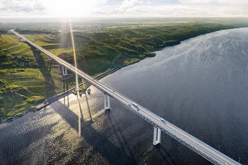 Keuken spatwand met foto "President" bridge over Volga river in Ulyanovsk, Russia aerial view at sunset © eshma