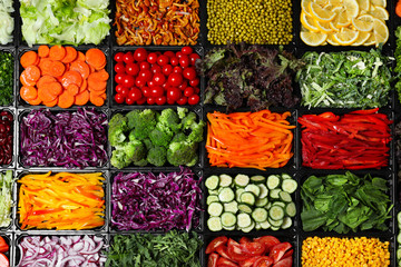 Salad bar with different fresh ingredients as background, top view