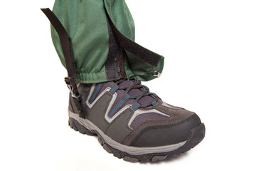 giaters and hiking boot on white background