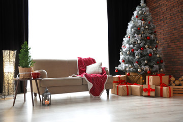 Stylish room interior with beautiful Christmas tree