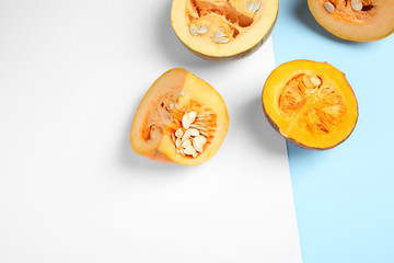 Fresh ripe pumpkins on color background, flat lay with space for text. Holiday decoration