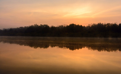 Naklejka na ściany i meble Morning fog on the river. Autumn