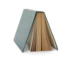 Open hardcover old book on white background