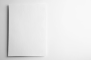 Blank paper sheet on white background, top view. Mock up for design