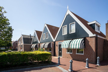 Fototapeta premium Typical houses at 'wijk 3' at the city of Urk, former island in the 'Zuiderzee' (South sea) yet a city at the border of the 'IJsselmeer' (Lake IJssel), Urk, NLD