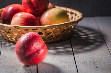 Fresh fruit nectarines healthy food.Harvest red and fresh nectarines . Pile of sweet fruits