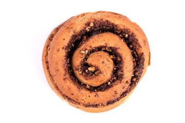 One freskly backed soft bun with cinnamon and nuts on white background