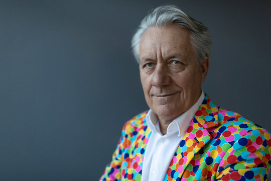 Portrait of a senior businessman wearing colorful sports jacket