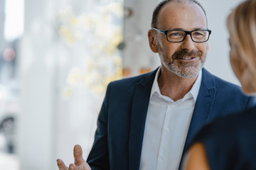Businessman and woman talking about solutions