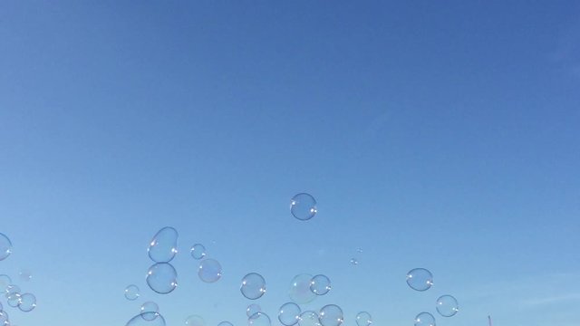 bubble bubbles floating background soapy blue sky with clouds  - stock footage video