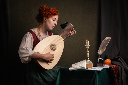 Red-haired girl in a historical suit plays the lute. Renaissance painting style.....
