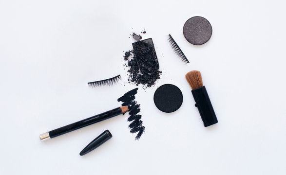 Black colored make up on a white background