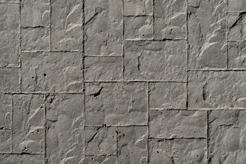 Fondo de pavimento de hormigón impreso con textura irregular