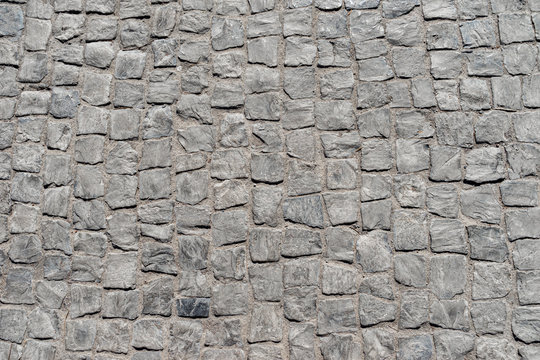 Fondo de pavimento empedrado de adoquines de piedra natural