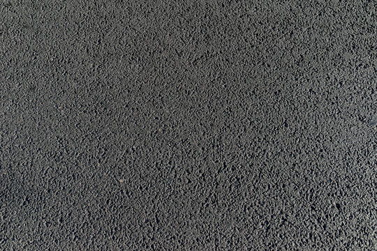 Fondo con textura de asfalto en calzada de calle urbana