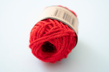 Red yarn balls as isolated white background, close up