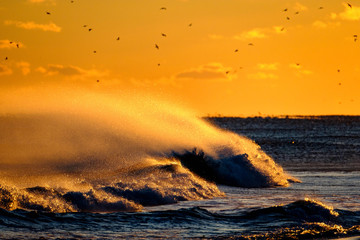Ocean sunset with waves and sun
