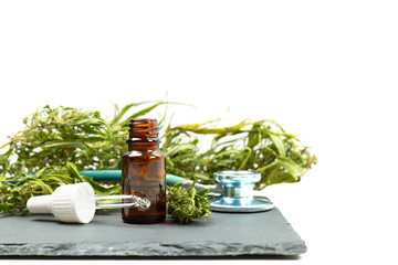Medical marijuana cannabis cbd oil and stethoscope. Alternative medicine for pain relief