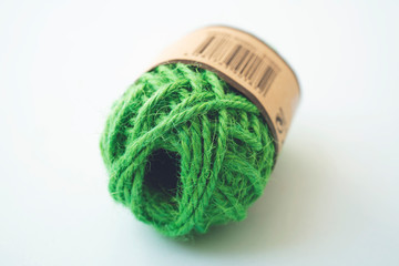 Green yarn balls as isolated white background, close up