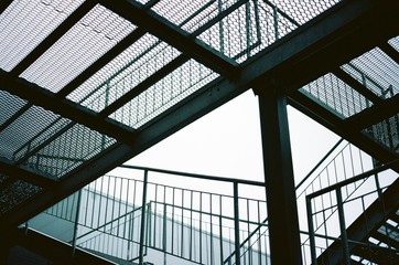 Fototapeta na wymiar metal construction. iron staircase. film photography
