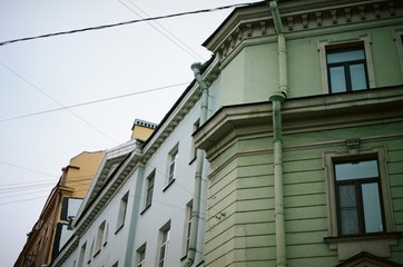 Fototapeta na wymiar Colorful houses in St. Petersburg, Russia. film photography