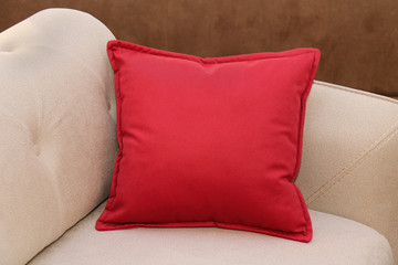 Red pillow on sofa