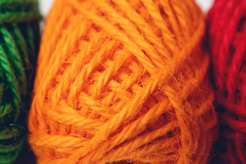 Colorful yarn balls as background, close up
