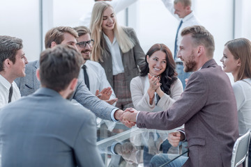 welcome handshake of business people at a meeting in the office