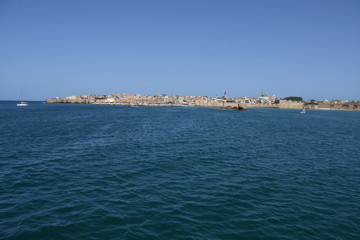 Fototapeta premium boat in the sea - small sailing old city