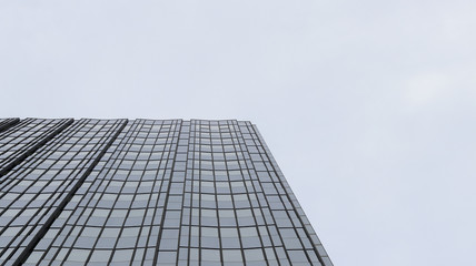 Facade of a glass building going to the sky
