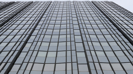 Facade of a glass building going to the sky
