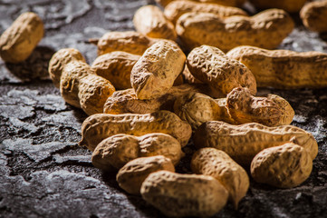 Dried peanuts or nuts on wooden background.peanut on wooden background, Peanuts seed, composition of peanuts serving to make oil, peanut butter