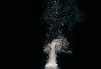 Tablet dissolving in water with bubbles