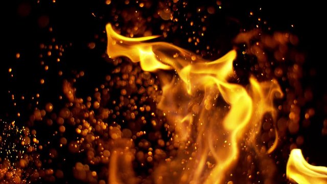 Fire flames and sparks in super slow motion isolated on black, shooting with high speed cinema camera at 4K
