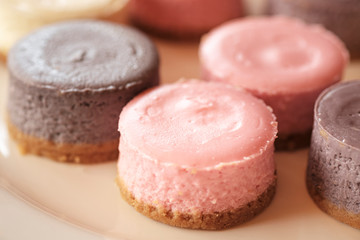 Pastel color round cheesecakes. Colorful cheesecake. Filled frame space. Dessert pattern
