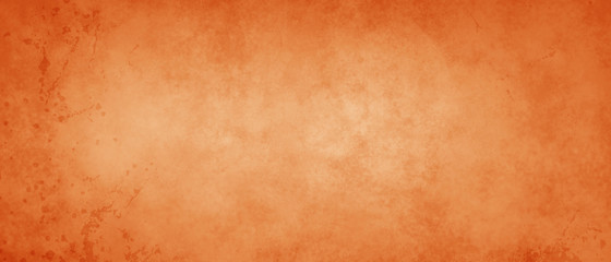Burnt orange autumn background with mottled vintage texture and distressed old texture with paint drips and drops spatter on the border, halloween or thanksgiving colors
