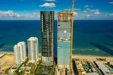 Aerial photo Porsche Design Tower and Turnberry Ocean Club luxury highrise condominiums on the beach