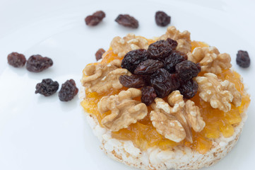  Rice biscuit with papaya candy, nuts and raisins.