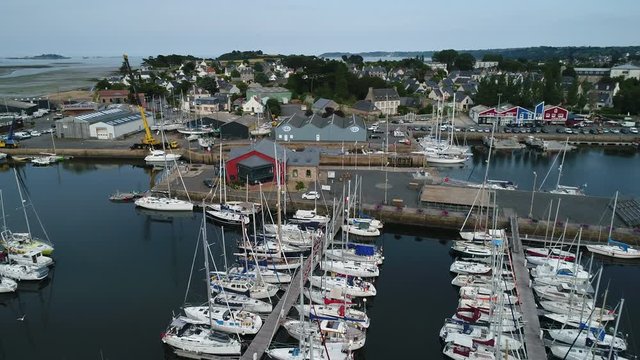 Aerial view. Gateway and moorage for boats and yachts in the Marina closed at low tide in the town of Paimpol in Northern France, in Brittany.