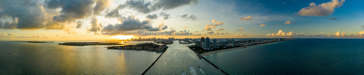 Aerial drone panorama Miami Beach inlet sunset twilight shot