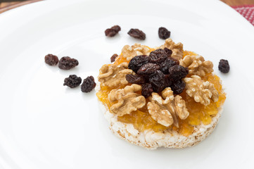  Rice biscuit with papaya candy, nuts and raisins.