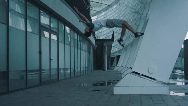 parkourist guy makes a coup in the air