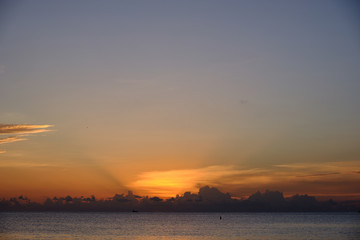 A perfect end of day sunset on the west side of the Cayman Islands on Seven mile beach British West Indies