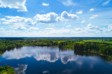 Naklejka na ściany i meble Summer landscape, green forest and blue lake from above..