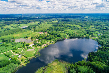 Summer landscape, green forest  and blue lake from above..