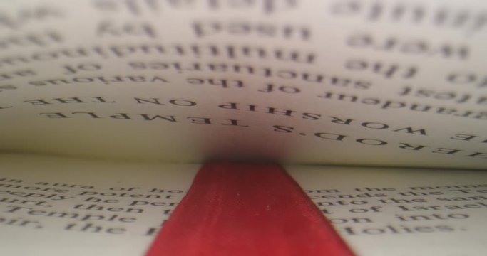 Macro shot moving down letters of a book