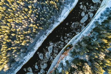 Aerial view of river with floating ice in cold winter. River Gauja, Latvia.