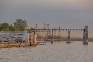 Samara, cargo port and Volga embankment at sunset
