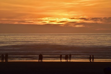 Walking on the beach at sunset
